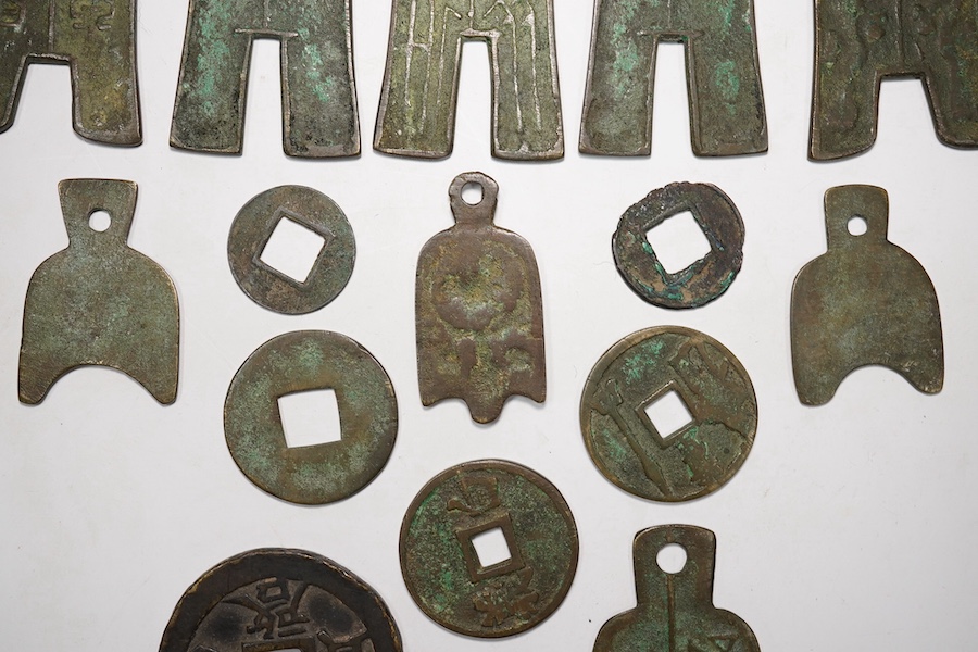 A group of Chinese replica spade coins, a Wu Zhu coin, and others